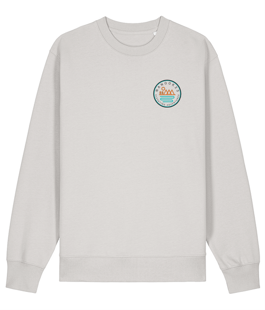 t: Limestone White off-white Nanook23 Mountains and Rivers organic cotton sweatshirt with a small orange and turquoise mountain and river badge on the left chest.