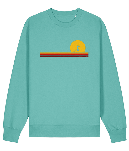 Shallows Blue turquoise Nanook23 First Light organic cotton sweatshirt with a paddleboarder silhouetted against a yellow sun above stripes of yellow, orange and red.