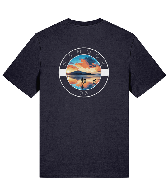 Back of the Midnight Navy dark blue Nanook23 Beach Walk t-shirt with a large print of a person walking two dogs across a beach at sunrise.