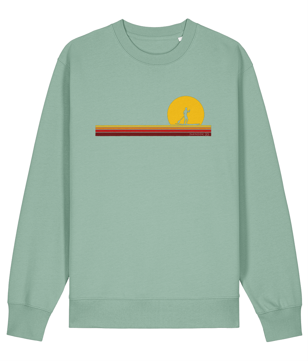 Sage Green soft green Nanook23 First Light organic cotton sweatshirt with a paddleboarder silhouetted against a yellow sun above stripes of yellow, orange and red.