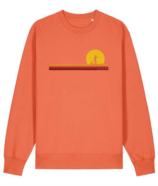 Campfire Red Nanook23 First Light organic cotton sweatshirt with a paddleboarder silhouetted against a yellow sun above stripes of yellow, orange and red.